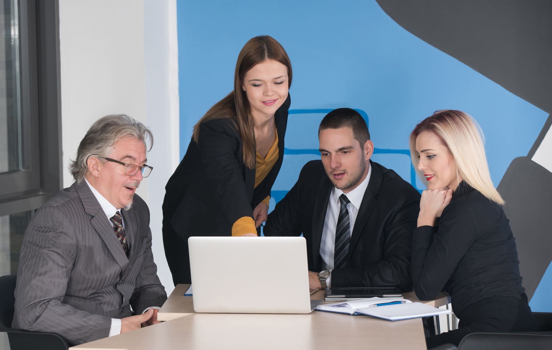 business partners discussing documents and ideas at meeting